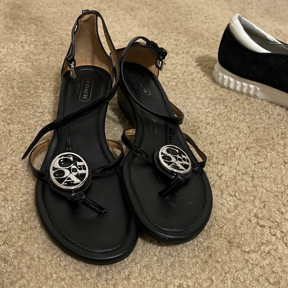 Selling a black coach sandals in a size 7 in very good condition